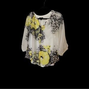 Bright and cheery top. Comes with a cami. # An unusual find .